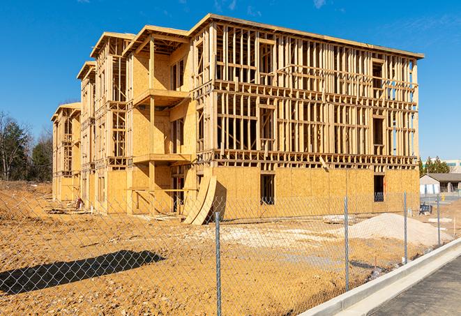 construction zone secured with a temporary fence, marked with warning signs in Walbridge